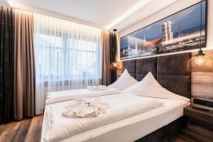 Postel nebo postele na pokoji v ubytování Hotel Demas München-Unterhaching