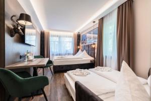 Postel nebo postele na pokoji v ubytování Hotel Demas München-Unterhaching
