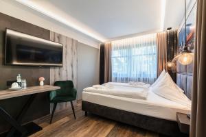Postel nebo postele na pokoji v ubytování Hotel Demas München-Unterhaching