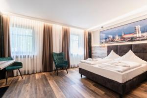 Postel nebo postele na pokoji v ubytování Hotel Demas München-Unterhaching
