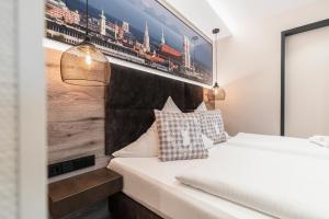 Postel nebo postele na pokoji v ubytování Hotel Demas München-Unterhaching
