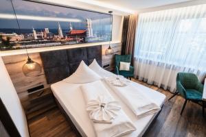 Postel nebo postele na pokoji v ubytování Hotel Demas München-Unterhaching