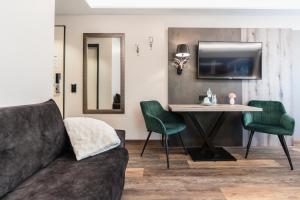 Posezení v ubytování Hotel Demas München-Unterhaching