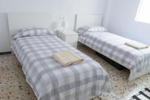 Säng eller sängar i ett rum på Teniente Ruiz 27