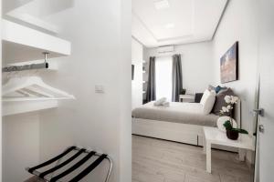 Maison Piazza Cavour tesisinde bir odada yatak veya yataklar