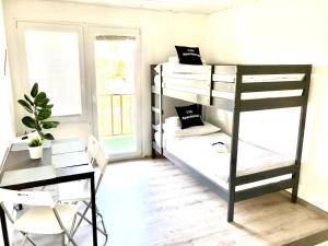 Poschodová posteľ alebo postele v izbe v ubytovaní City Apartment