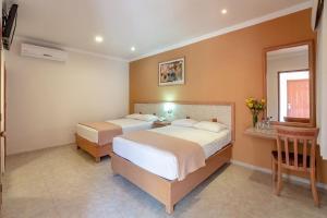 Postel nebo postele na pokoji v ubytování Tecnohotel Itzáes + 30 fotografií