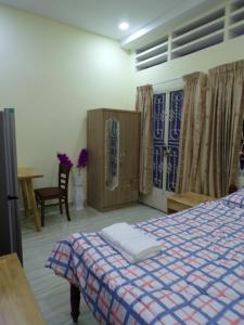 Un pat sau paturi într-o cameră la Ananta Canna