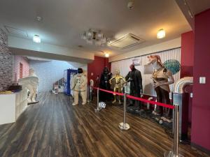 a room with costumes on display and a red ribbon at Marina Hotel Kaikuu - Vacation STAY 58502v in Kanayama