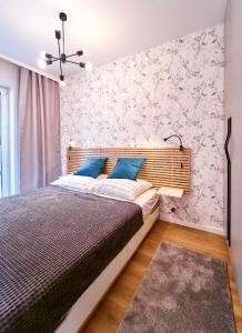 Posteľ alebo postele v izbe v ubytovaní LAGUNA Apartament Polanica Residence 17
