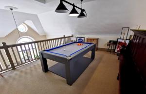 a pool table in the middle of a room at The Old Court House & Jail in Menai Bridge