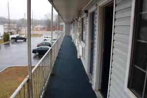 a hallway of a building with cars parked in a parking lot at Budgetel Inn & Suites Atlantic City in Galloway