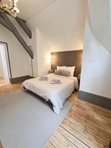 Ліжко або ліжка в номері Maison d'hôtes Au Cœur des Lacs