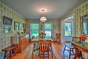 a kitchen and dining room with a table and chairs at Waterfront Schroon Lake Home with Boat Dock! in Schroon Lake