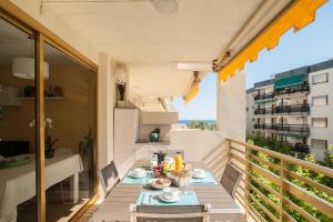 a table on the balcony of a apartment at L'Eixideta in Salou