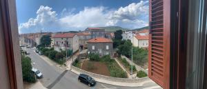 a view from a window of a city street with houses at Apartman Mujo in Cres