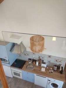 a kitchen with a sink and a counter top at Villa Vista in Sesimbra