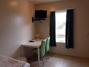 TV a/nebo společenská místnost v ubytování Vinland Guesthouse