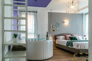 a bedroom with a large bed and a ladder at 4 Star Suite SPA - Self Check-In in Bologna +178 photos