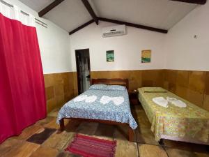 Cama ou camas em um quarto em Castelo das Dunas Camping e MotorHome