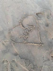 a heart drawn in the sand on the beach at Holden Beach, NC Your Way # 2 in Holden Beach
