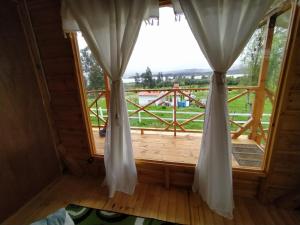 Balkón nebo terasa v ubytování Cabaña La Granja tomine