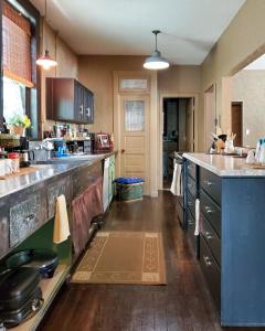 a large kitchen with a large counter top and a counterspect at Guest Apartment at Commercial Street Studio in Lebanon