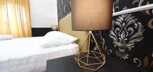 Rome Aparts客房内的一张或多张床位