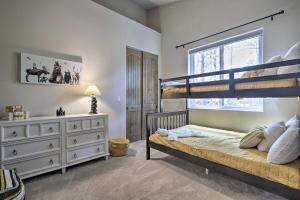 a bedroom with a bunk bed and a dresser at Stylish Home with Expansive Deck in Show Low! in Show Low