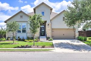 a large white house with a garage at Upscale Austin Area Escape Families Welcome! in Austin