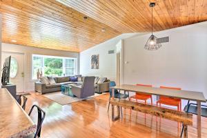 a dining room and living room with a wooden ceiling at Updated Family Home about 1 Mile to Delaware River! in Narrowsburg