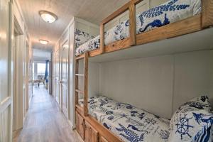 a bedroom with two bunk beds and a hallway at Oceanfront Corpus Christi Escape with Community Pool in Corpus Christi +16 photos