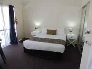 Säng eller sängar i ett rum på Comfort Inn Premier