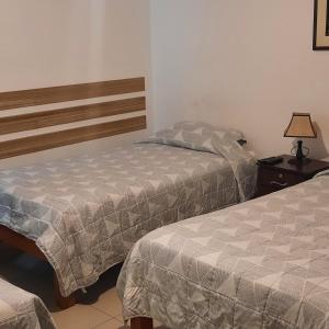 Ein Bett oder Betten in einem Zimmer der Unterkunft Marlon's House Arequipa