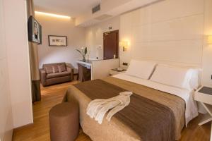Postel nebo postele na pokoji v ubytování Hotel Oxford + 22 fotografií