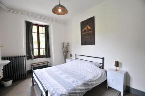 Ein Bett oder Betten in einem Zimmer der Unterkunft Gite le Belvedere