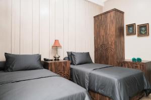 Postel nebo postele na pokoji v ubytování Nonies Huis Cibubur