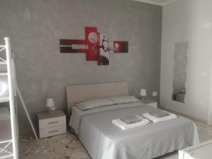 Postel nebo postele na pokoji v ubytování Dimora Varchi