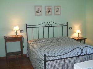 Postel nebo postele na pokoji v ubytování Agriturismo Poggio Sassineri
