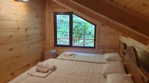 Postel nebo postele na pokoji v ubytování Guest House Okropilauri