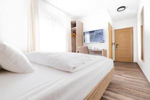 
Ein Bett oder Betten in einem Zimmer der Unterkunft Landhotel Kirchberg
