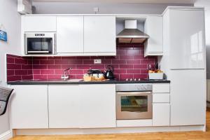 A cozinha ou kitchenette de Delven House, Apartment 4