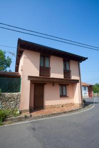 a small house on the side of a street at VILLA ISABEL in Piloña