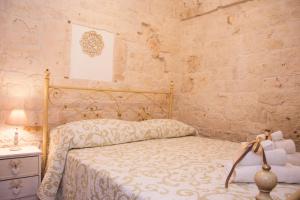 Postel nebo postele na pokoji v ubytování Trullo Sweet Trullo