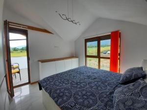 A bed or beds in a room at Mountain Villa near Bansko