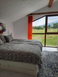 A bed or beds in a room at Mountain Villa near Bansko