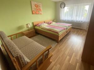 Postel nebo postele na pokoji v ubytování Ferienwohnung Fackelmann