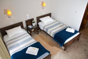 Postel nebo postele na pokoji v ubytování Hotel Peli