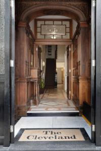 a hallway with a sign that reads the overwhelmed at The Cleveland in London