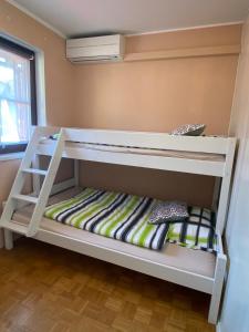 a bedroom with two bunk beds in a room at Apartmán Perspekta 196 in Čatež ob Savi